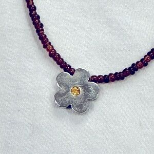 Cute silver flower necklace with yellow crystal on beaded necklace